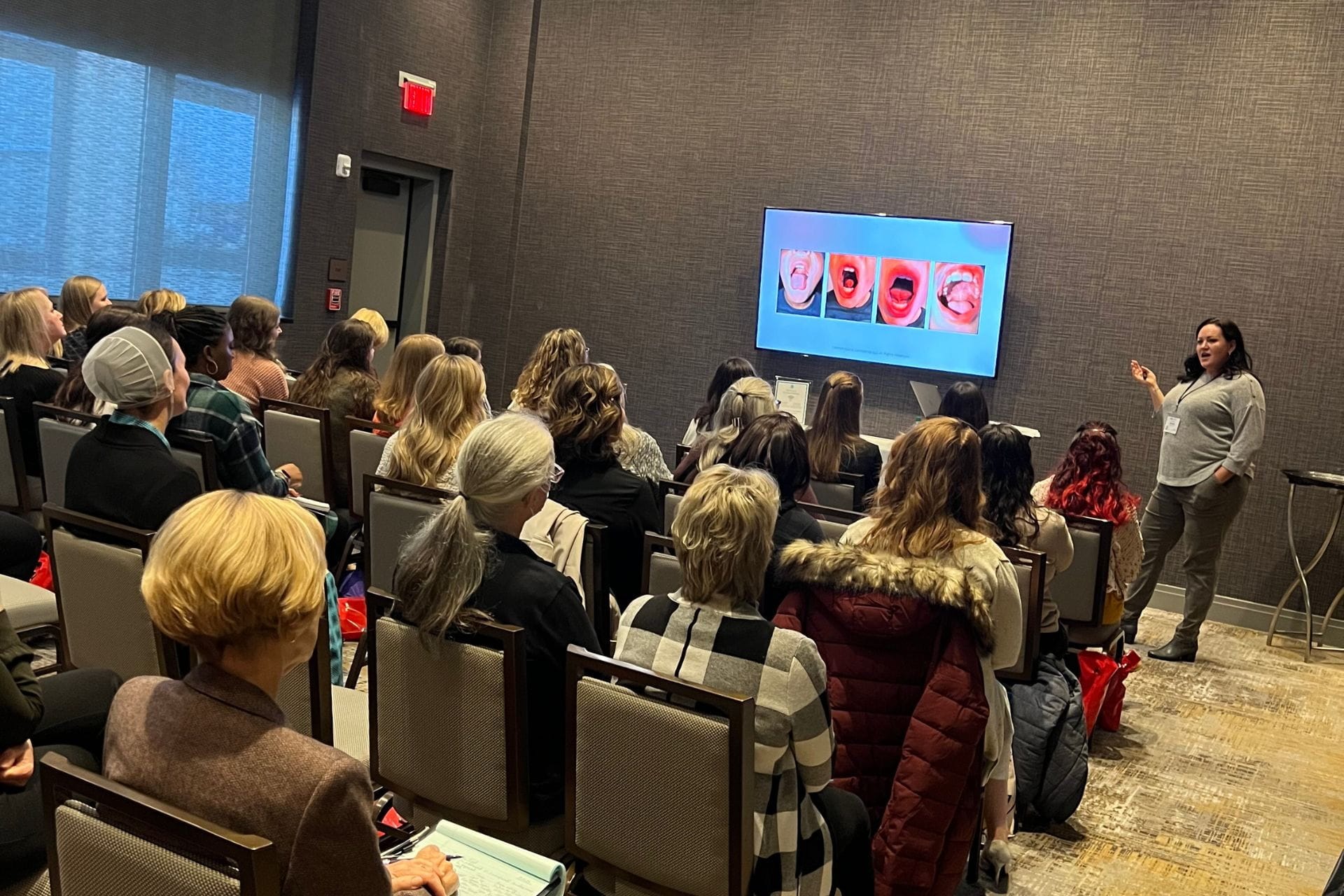 Carmen Ball teaching dental hygienists and myofunctional therapists how to build profitable myofunctional therapy businesses